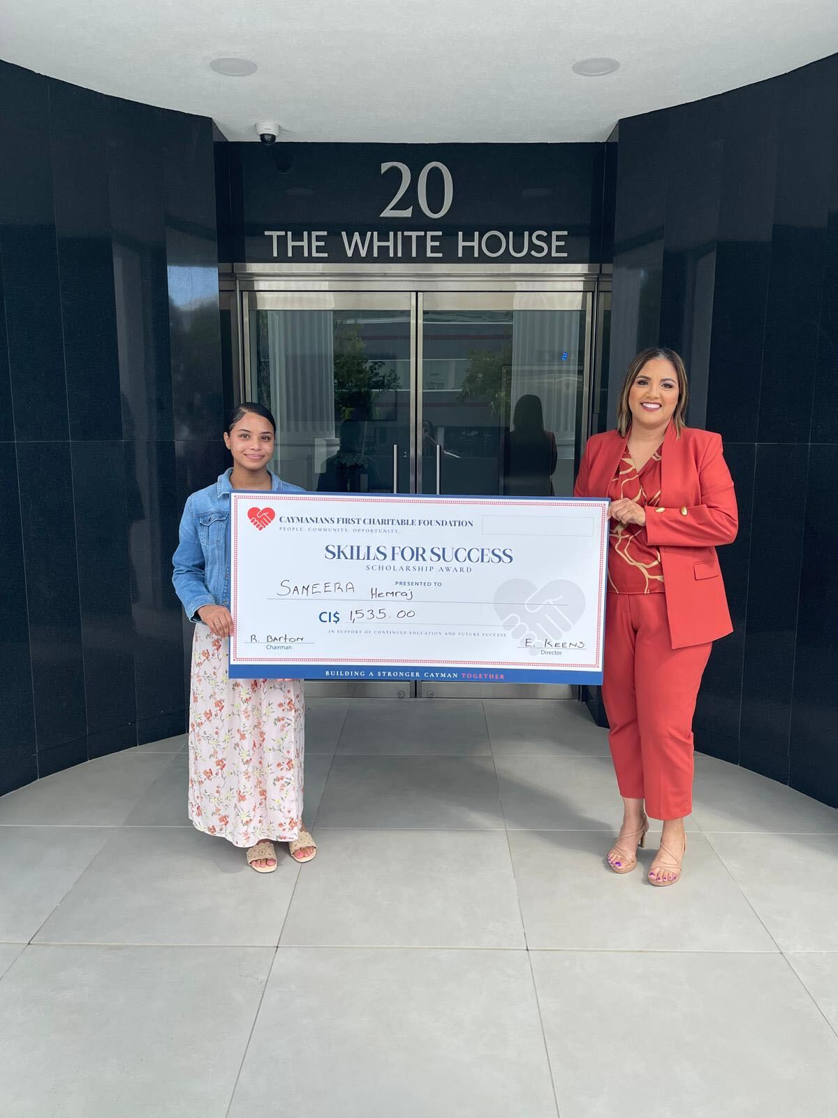 Sameera Hemraj, left, with a Foundation representative holding her Skills for Success scholarship presentation cheque.